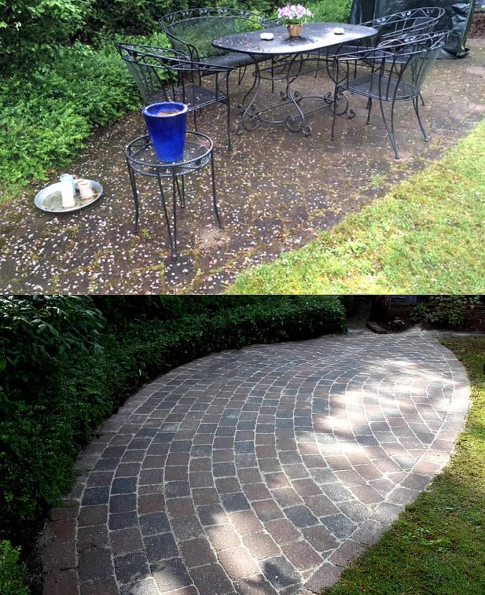 Gartenbereich mit Tisch, Stühlen und einem blauen Blumentopf auf unregelmäßigen Steinen.